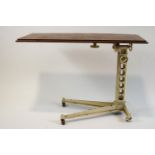A cast iron and mahogany adjustable reading or bed table,