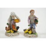 Two polychrome decorated Meissen style hard paste porcelain Dresden figures showing a lady and a