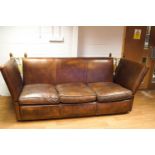 A brown leather Knowle sofa with three loose cushions, from Leather chairs of Bath,