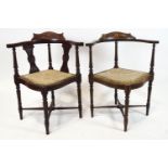 An Edwardian mahogany and marquetry corner chair on turned tapering legs linked by stretchers,