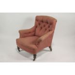 A 19th century armchair, possibly by Howard of London, numbered to rear leg,