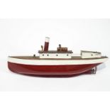A pond yacht style wood and metal model of a steam yacht in a cream and red finish,