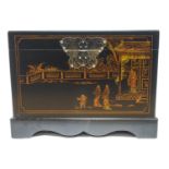 A Chinoiserie box, decorated with figures by a building,