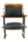 An early 20th century oak framed cinema chair,