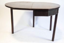 A 19th century mahogany drop leaf table, with canted supports and single gate leg,