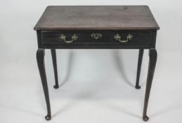 A mid 18th century provincial oak side table,