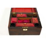 A Victorian rosewood sewing box, with mother of pearl inlaid escutcheon and part fitted interior,