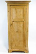 A 19th century stripped pine cupboard,