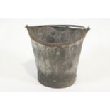 A GWR fire bucket with wrought iron swing handle, stamped ,