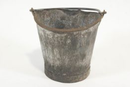 A GWR fire bucket with wrought iron swing handle, stamped ,