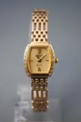 A yellow metal Rotary elite wristwatch. Mother of pearl dial with diamond set bezel.