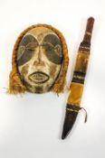 An African carved mask with plaited hair, 32cm high,