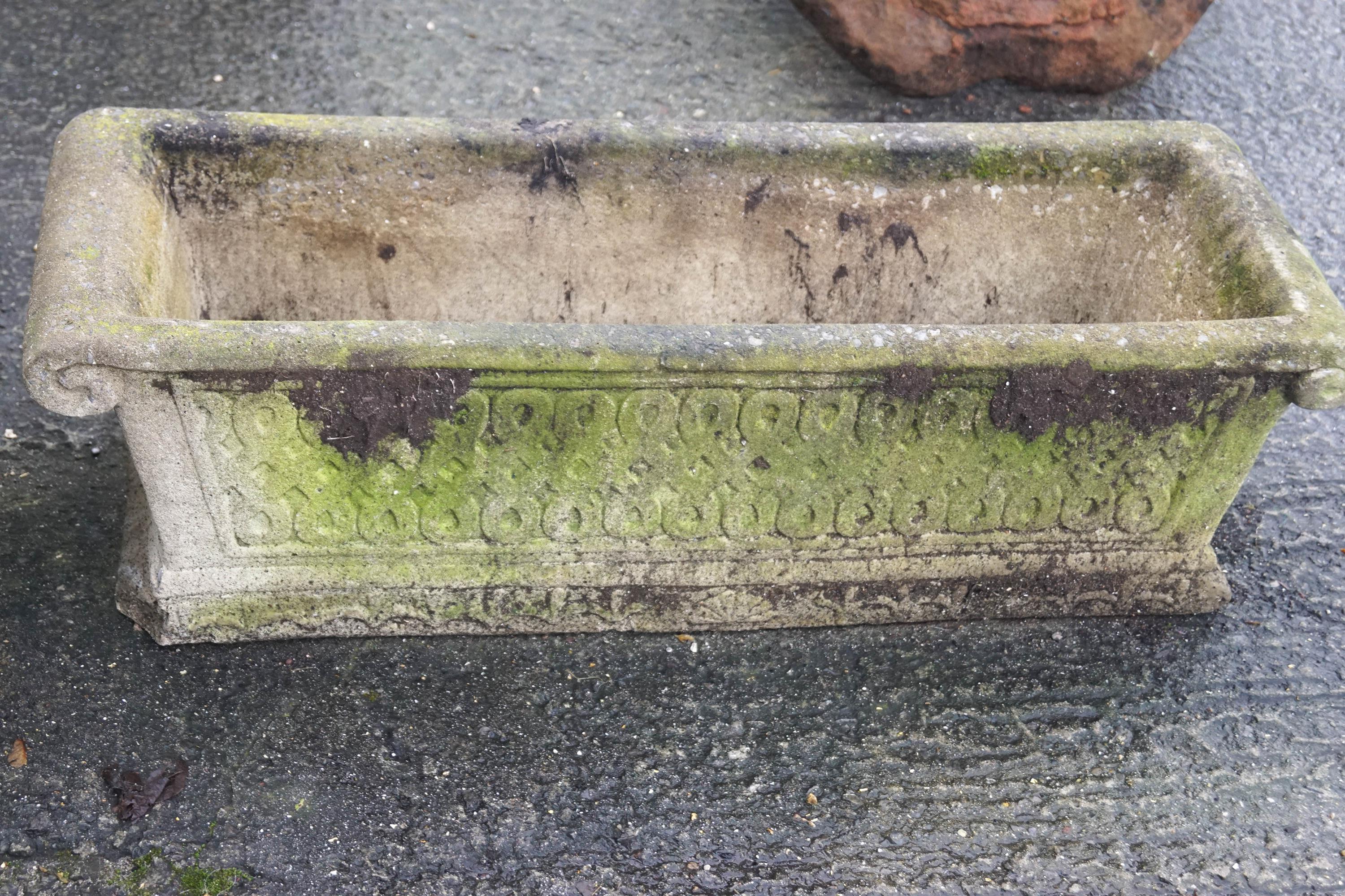 A pair of reconstituted stone trough planters with blind fret decoration to sides, - Image 2 of 2