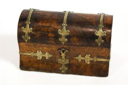 A late 19th century Continental walnut dome top trinket box with Gothic brass mounts,