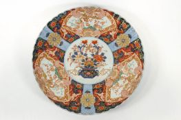 A large Japanese porcelain Imari charger,