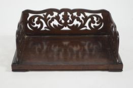 A Victorian rosewood book caddy with pierced back and sides, 39cm x 26.