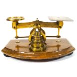 An early 20th century brass set of letter scales with weights,