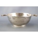 A silver spot hammered finish quaich, of traditional form, Birmingham 1923, 4.