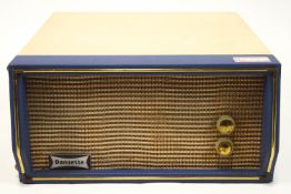 A Dansette Troubadour table top record player with cream and blue case enclosing the turn table and