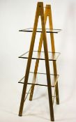 A beech wood, brass and glass three storey etagere,