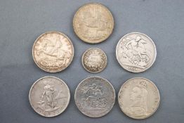 A collection of seven coins to include: Crowns, Peso's and a shilling. Dating from 1819 to 1935.