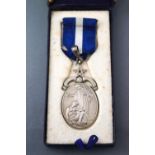 A silver pendant medal in fitted case. Hallmarked sterling silver, London, 1951. 38.