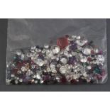 A large collection of loose gemstones to include colourless cubic zirconia,