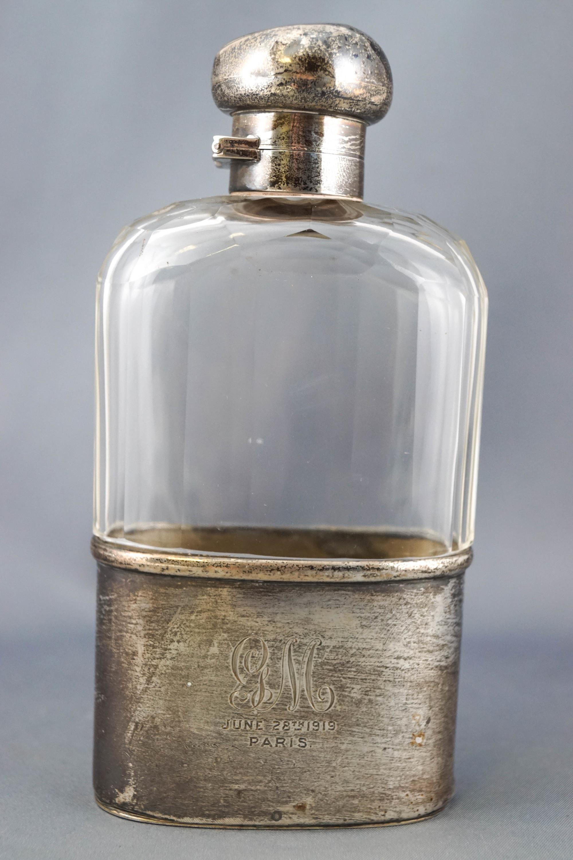 A silver and glass hip flask,