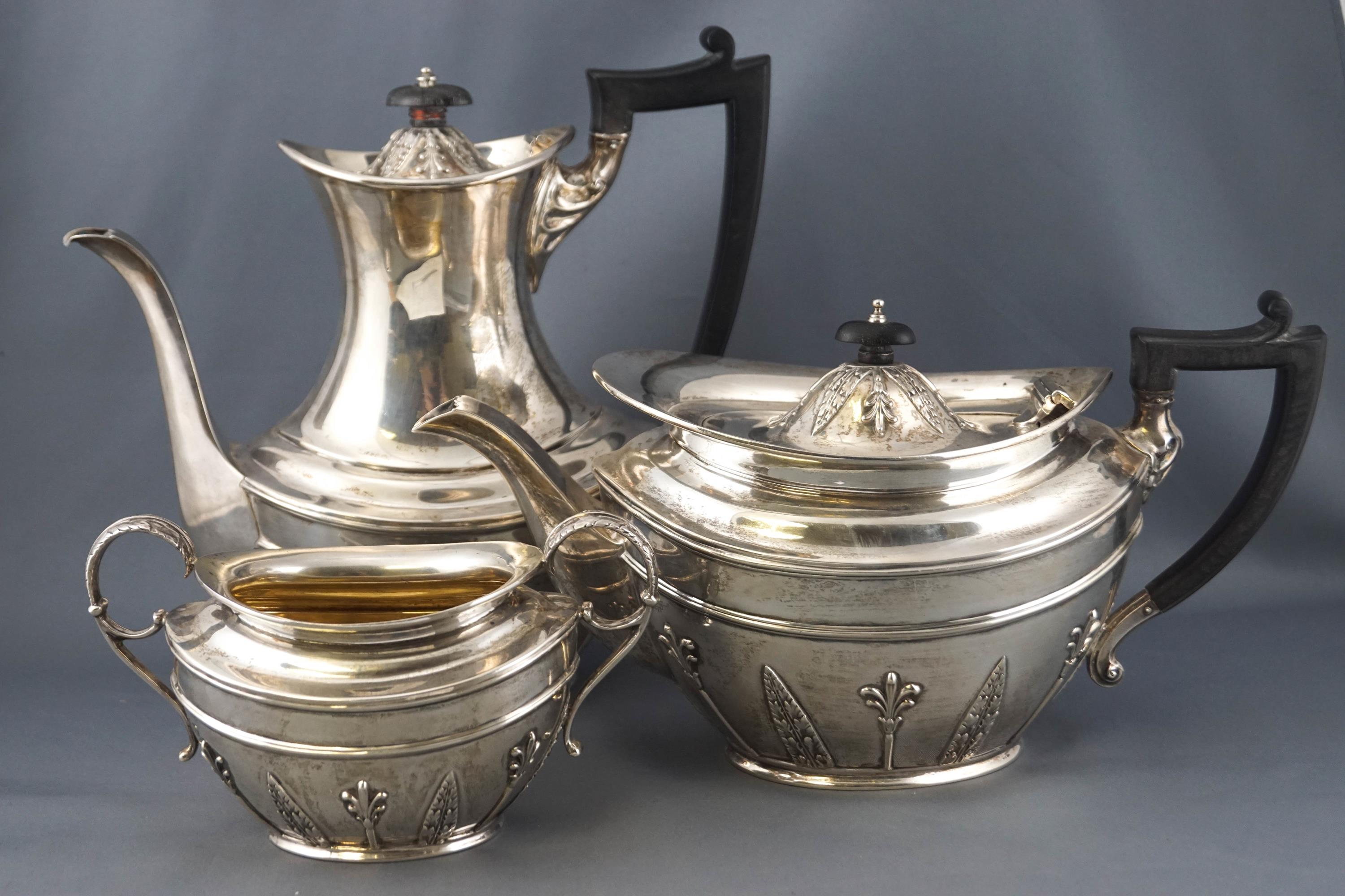 A silver French style four piece tea and coffee service, of oval form, with domed covers,