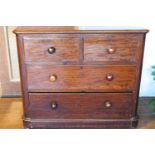 A Victorian mahogany chest of two short and two long drawers with turned handles,