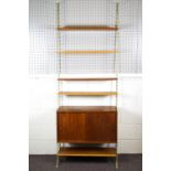A Swedish painted metal and teak 'string' ladderax style wall unit with base cupboard set with two
