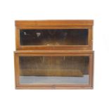 A mahogany two tier Globe Wernicke style bookcase, with lift up glazed doors,