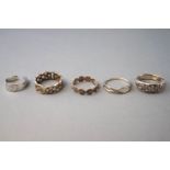 A collection of ten silver dress rings of variable designs. Ranging in size from G to Q.