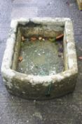 A carved stone trough,