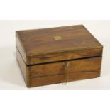 A Victorian mahogany and brass bound writing slope with a label to the interior,