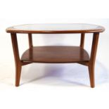 A G-plan style coffee table, the oval top with central glass panel,