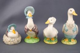 Four Beswick Beatrix Potter figures, 'Jemima Puddleduck', 11cm high; 'Rebeccah Puddle Duck',