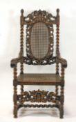 A Victorian carved Daniel Marot style chair, with caned seat and back,