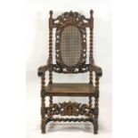 A Victorian carved Daniel Marot style chair, with caned seat and back,