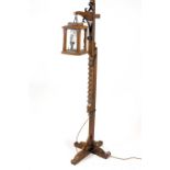 An oak adjustable standard lamp,