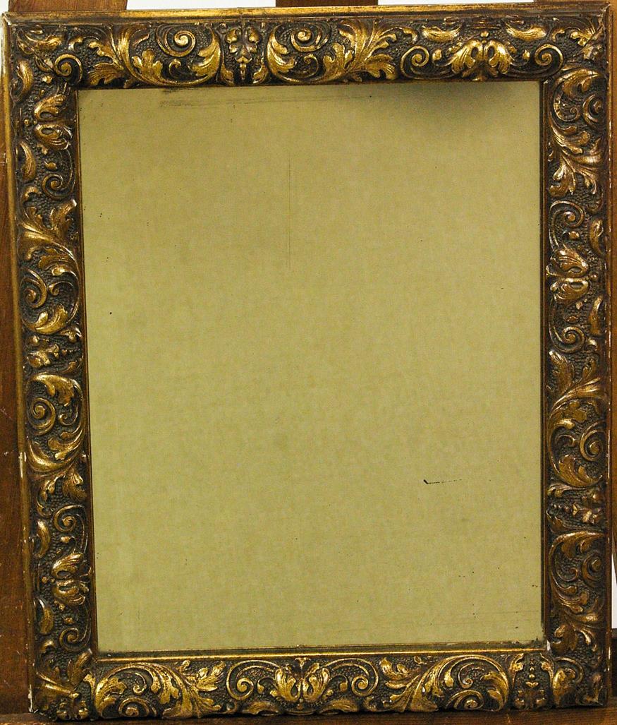 A rectangular gilt framed wall mirror with foliate scroll decoration,