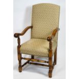 An oak Carolean style scroll end arm chair, raised on turned legs and stretchers,