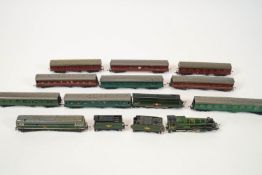 Four Triang table top locomotives and carriages with a selection of carriages and assorted freight