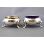 Two Georgian silver cauldron salts, of traditional three leg form, marks rubbed,