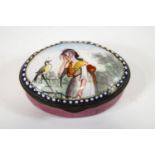 A late 18th century Bilston enamel oval enamel patch box polychrome decorated to the hinged cover