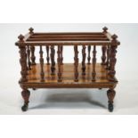 A Victorian walnut and marquetry Canterbury with turned uprights,