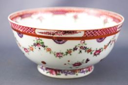 An 18th century Chinese porcelain slop bowl, decorated with famille rose enamels,