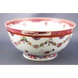 An 18th century Chinese porcelain slop bowl, decorated with famille rose enamels,