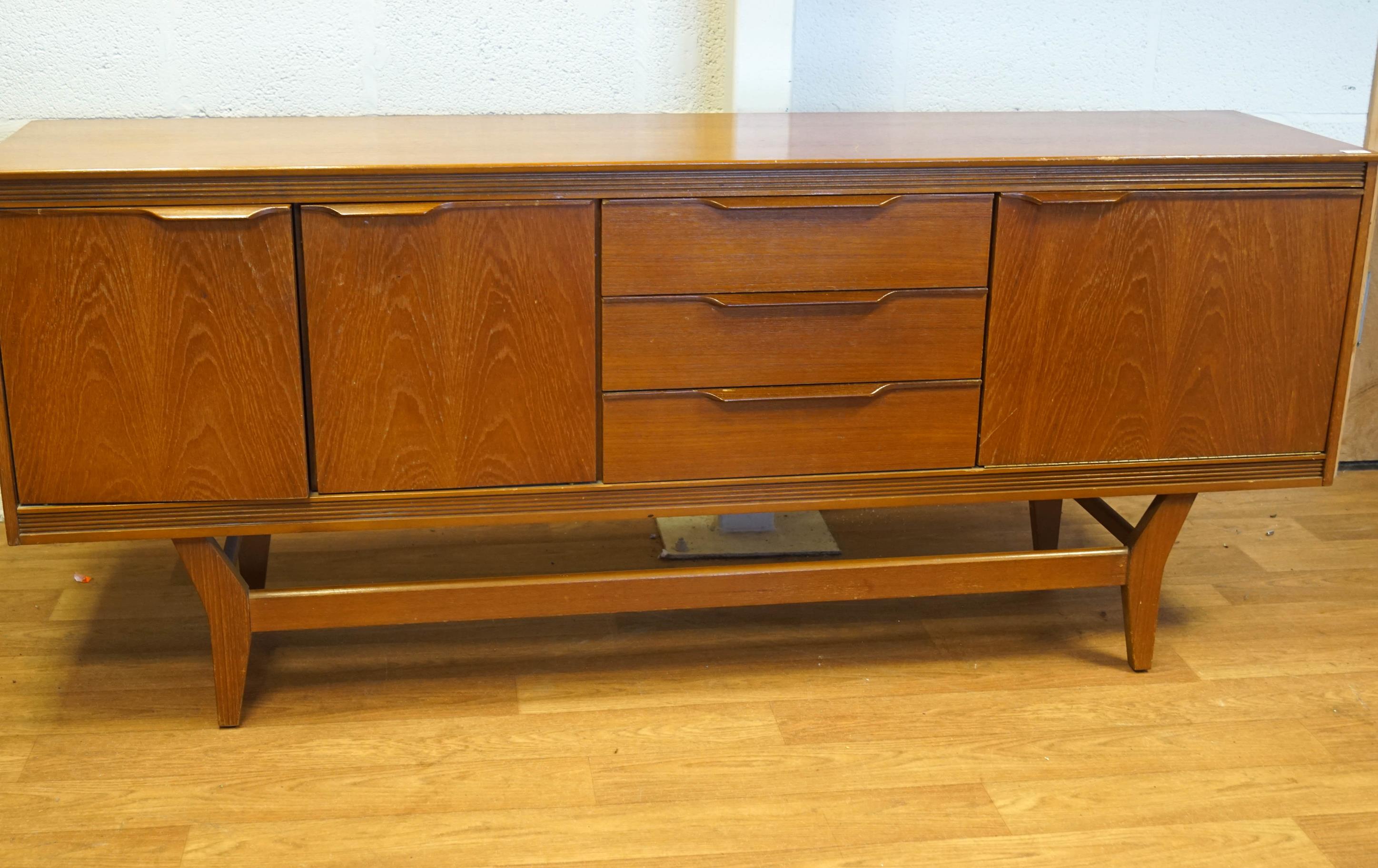 A G-plan teak sideboard, fitted an arrangement of cupboards,