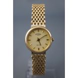 A hallmarked 9ct yellow gold rotary elite wristwatch. Quartz movement. 9ct yellow gold bracelet.